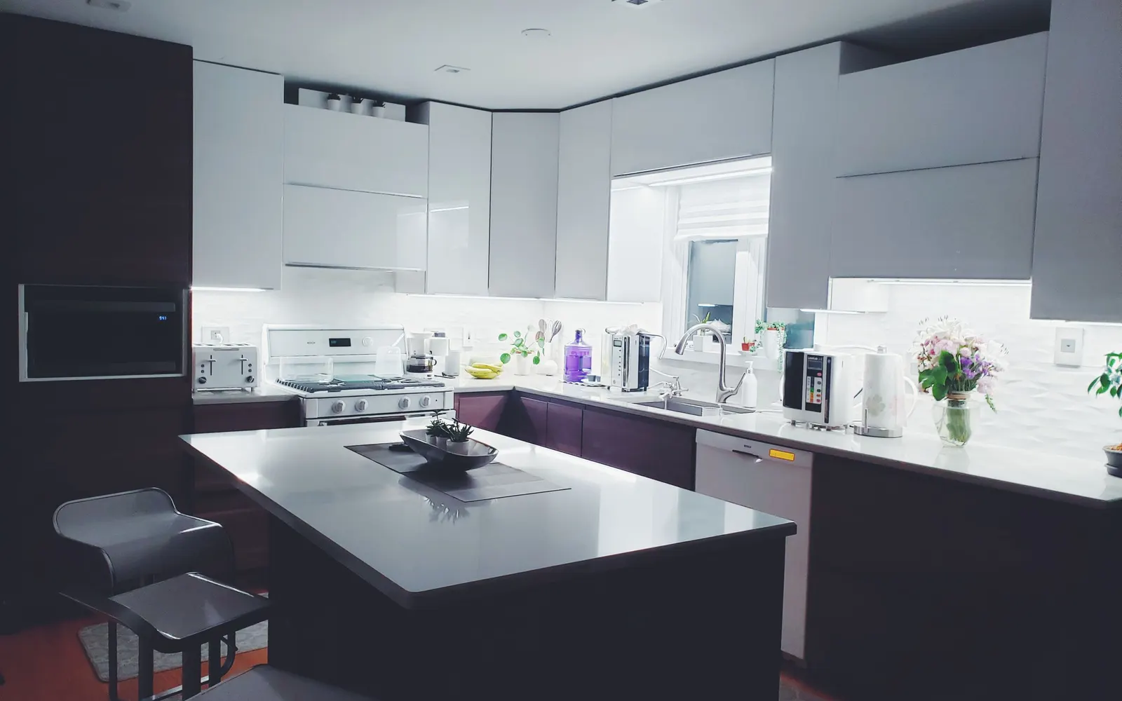 Open-plan kitchen with a full-height pantry wall — after