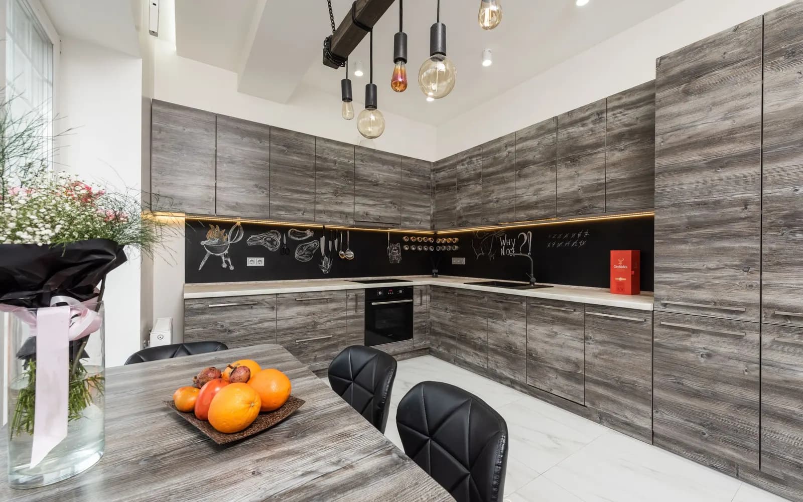 Open-plan kitchen with a full-height pantry wall — before