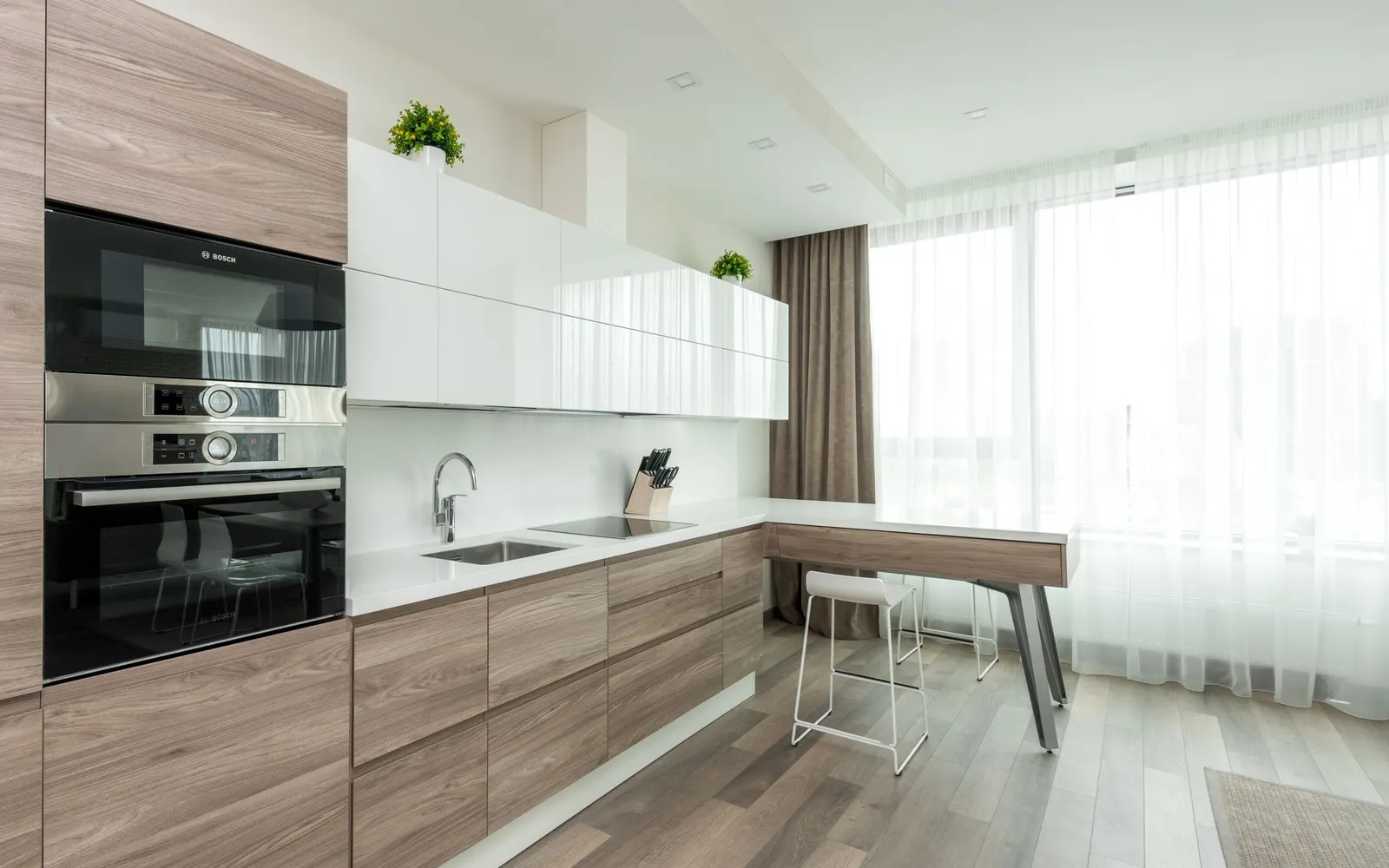 Warm oak kitchen with an island — after